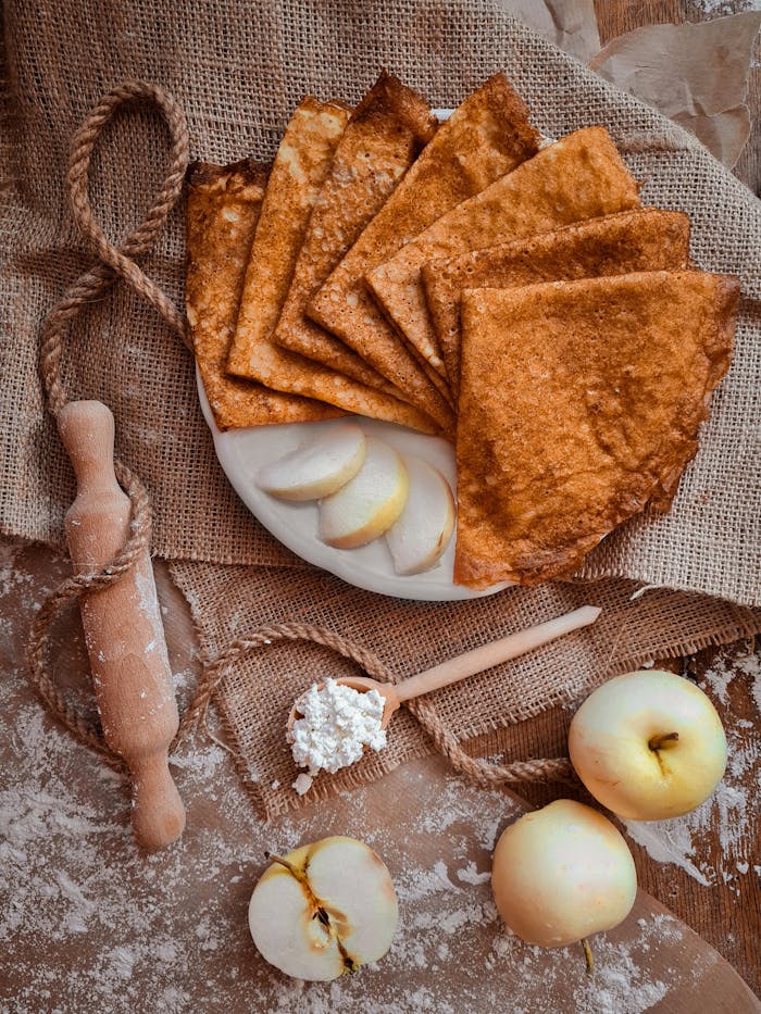 Crafting Captivating Headlines: Your awesome post title goes here Flat lay of rustic crepes, fresh apples, and cottage cheese on burlap, perfect for autumn mood.